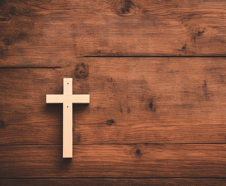 Wooden cross on old wooden background. Christian symbols. Religion concept.の写真素材