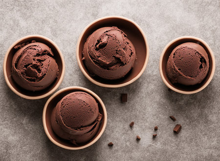 Scoops of chocolate ice cream in a bowl on stone backgroundの写真素材