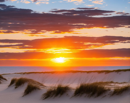 Sunset over the Baltic Sea with dunes and sand dunesの写真素材