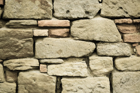 Old stone wall. Antique wall made of natural stone