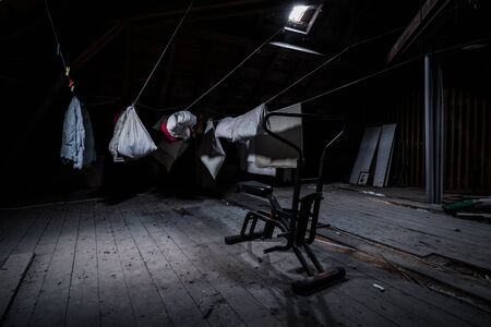 training bicycle and washing in the attic of an abandoned villaの写真素材