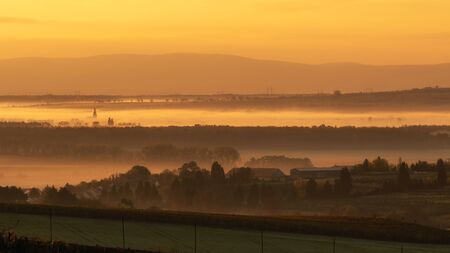 Foggy sunrise over fields in Bohemian Moravia