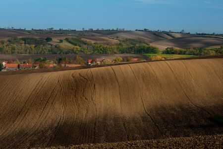 Beautiful harsh landscape of plowed Moravian fields in the autumn seasonの写真素材