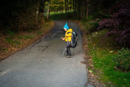 My son is facing a large backpack from his dad. polish mountainsの写真素材