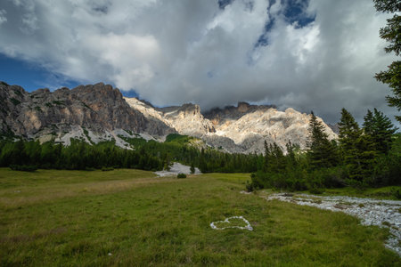 Rapid river flowing through the valley in the Italian Dolomites. Dolomites, Italyの写真素材