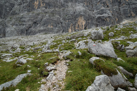 Rocky mountain slope covered with grass in the dolimites. Dolomites, Italyの写真素材