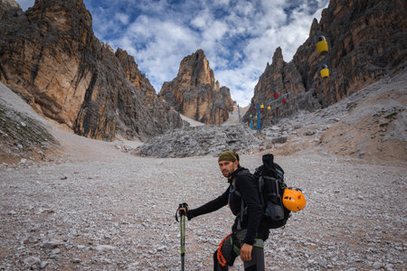 Tourist in inventory on the gutter trail with gondola lift to Forcella Staunies, Monte Cristallo Group, Dolomites, Italyの写真素材