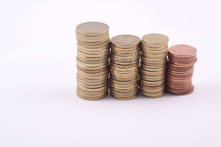 a diversity of coins isolated on a white backgroundの写真素材