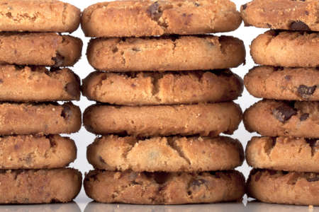 close up of three piles of chocolate chip cookies. High calories but very nice and tastefull freshly...