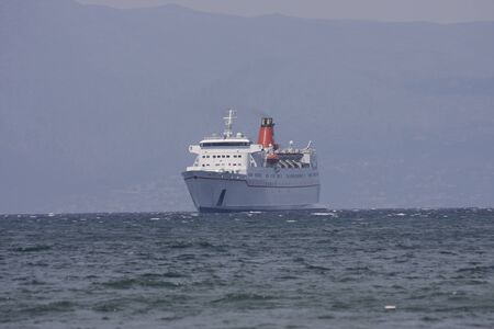 Passenger and car ferry at sea Cesme Turkeyの写真素材