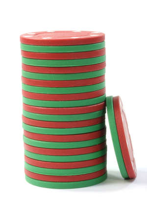 Stacked poker casino gambling chips isolated on white background の写真素材