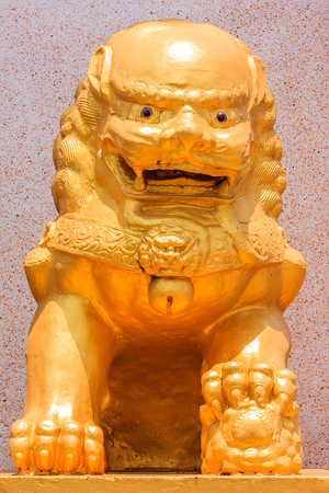 Golden Lion Sculpture at Front of Chinese Templeの写真素材