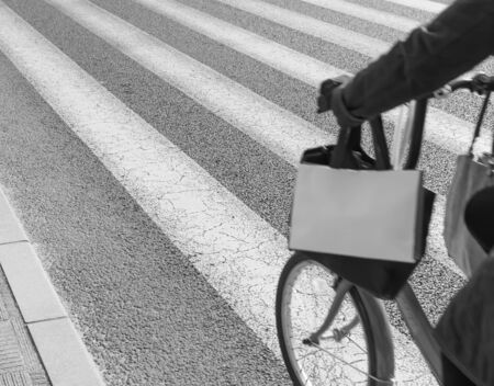 Zebra crossing with bicycle moving on foreground (black & white)