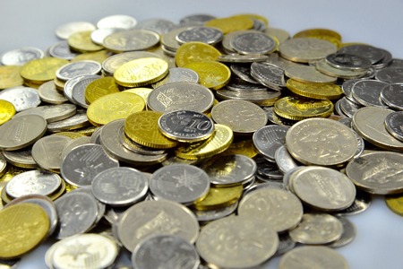 coins over the white background