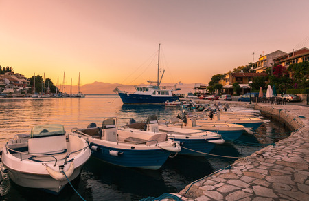 Sea bay with boats and yachts at sunsetの写真素材