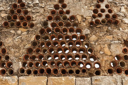 Stone wall with round ceramic parts close-up, Jerusalemの写真素材
