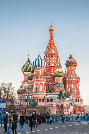 MOSCOW, RUSSIA NOVEMBER 28, 2015: Tourists near Saint Basil's Cathedral 1555-1561 on Red Square. The...