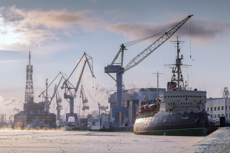 SAINT PETERSBURG, RUSSIA - JANUARY 07, 2016: Icebreaker Krasin 1916-1916 on the river Neva in winter, now it is a museum ship. Cranes of Baltic Shipyardのeditorial素材