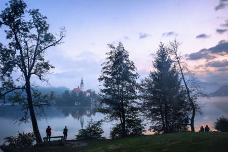 Dawn over Bled Lake, island with Pilgrimage Church, Slovenia.の写真素材