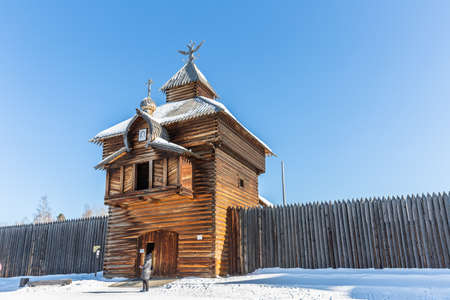 Russia, Irkutsk region - February 22, 2021: The Spasskaya (Savior tower) of Ilimsk Ostrog town (1667) in architectural and ethnographic Museum "Taltsy, Siberiaのeditorial素材