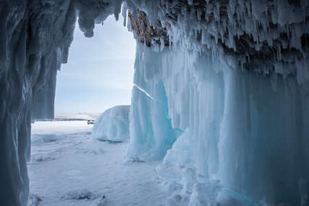 Ice cave, Icicles in the rocky caves, Lake Baikal in winter, Siberia, Russiaの写真素材
