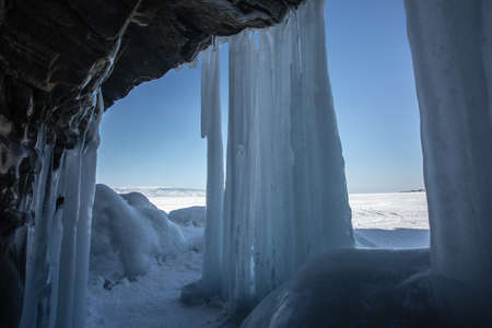Ice cave, Icicles in the rocky caves, Lake Baikal in winter, Siberia, Russiaの写真素材