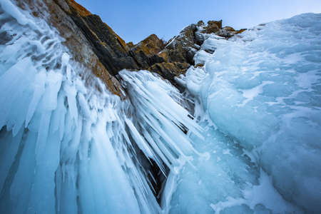 Icicles in the rocky caves. Winter at Lake Baikalの写真素材