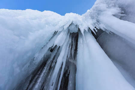 Icicles in the rocky caves. Winter at Lake Baikalの写真素材