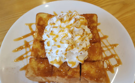 Honey toast topping with whip cream and caramelの写真素材