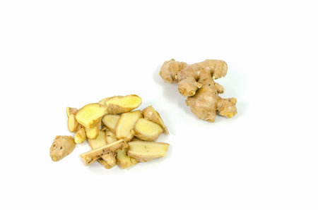 Fresh and sliced ginger root isolated on white backgroundの写真素材