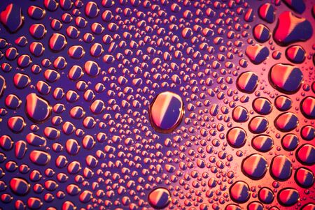 water drop in purple backgroundの写真素材