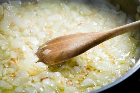 Fried onions in a griddle の写真素材