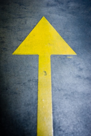 yellow arrow in a roadの写真素材
