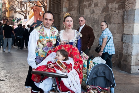 VALENCIA, SPAIN - MARCH 17: Unidentified family walk in the presentation of the fallas, one of the biggest parties in Spain where people dresses traditionally on march 17, 2012 in Valencia, Spain のeditorial素材