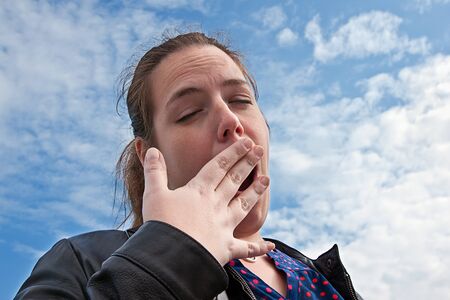 Portrait of a young woman with a surprised expressionの写真素材