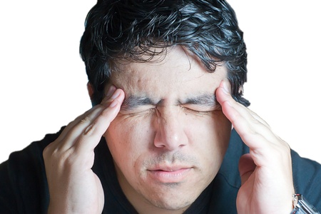 young man holding head in painの写真素材