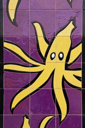 yellow and purple bananas tile backgroundの写真素材