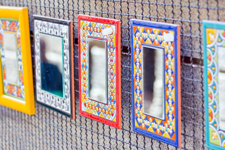 colorful decorative mirrors in a marketの写真素材