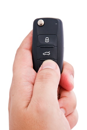 Man hand holding a garage door remote control の写真素材
