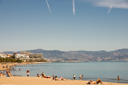 TORREMOLINOS - APRIL 09: Torremolinos beachfront. The Costa del Sol is a popular tourist region that welcomes millions of people annually on April 09, 2012 in Torremolinos, Malaga, Spain.のeditorial素材