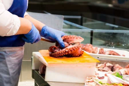 fishmonger in a marketの写真素材