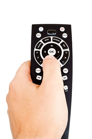man holding a tv remoteの写真素材