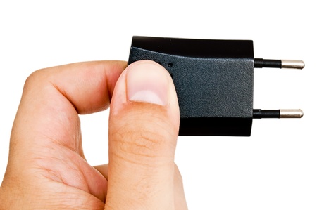 man holding a black plugの写真素材