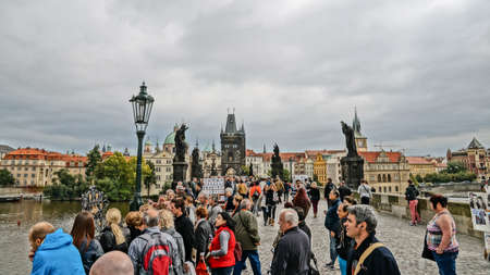 PRAGUE, CZECH REPUBLIC - SEPTEMBER 24: People visit Charles' Bridge on September 24, 2013 in Prague, Czech Republic. Prague is a UNESCO World Heritage Site.のeditorial素材