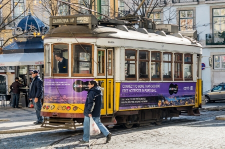 LISBOA, PORTUGAL - NOVEMBER 28: Traditional yellow tram/funicular on November 28, 2013 in Lisbon, Portugal. Carris is a public transportation company operates Lisbon's buses, trams, and funiculars.のeditorial素材
