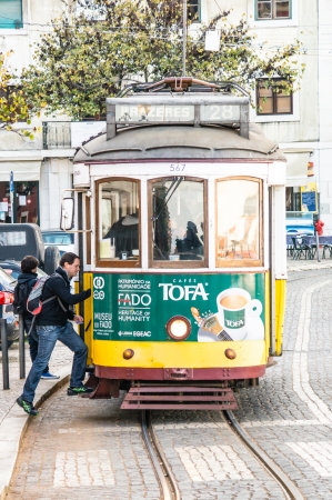LISBOA, PORTUGAL - NOVEMBER 28: Traditional yellow tram/funicular on November 28, 2013 in Lisbon, Portugal. Carris is a public transportation company operates Lisbon's buses, trams, and funiculars.のeditorial素材