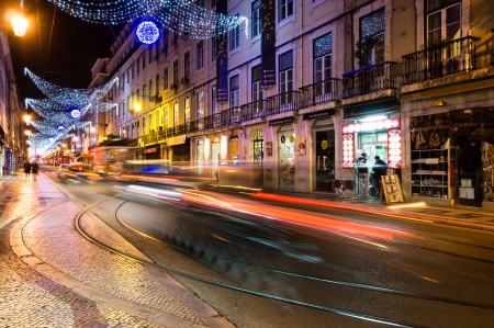 LISBOA, PORTUGAL - NOVEMBER 30: Light trails in Lisbon street on November 30, 2013 in Lisbon, Portugal. Lisbon is the capital and the largest city of Portugal with a population of 547,631のeditorial素材