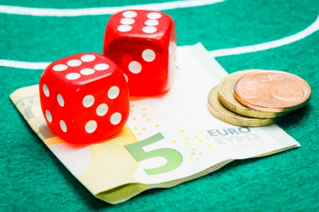 two red dice with eurosの写真素材