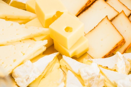 Composition with different sorts of cheesesの写真素材