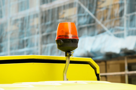 orange siren in a yellow ambulanceの写真素材